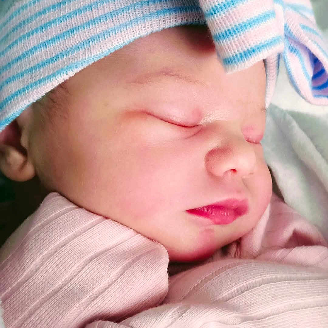 Praiselynn joined the competition — help win amazing prizes! baby, child, close_up, cute, ear, face, hat, infant, lip, newborn, nose, peaceful, pink_blanket, portrait, skin, sleeping, small, soft_texture, striped_hat, wrapped