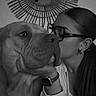 dog, woman, kiss, love, affection, black_and_white, portrait, face, glasses, earrings, watch, decor, wall_art, indoor, close_up, pet, companion, human, animal, intimacy