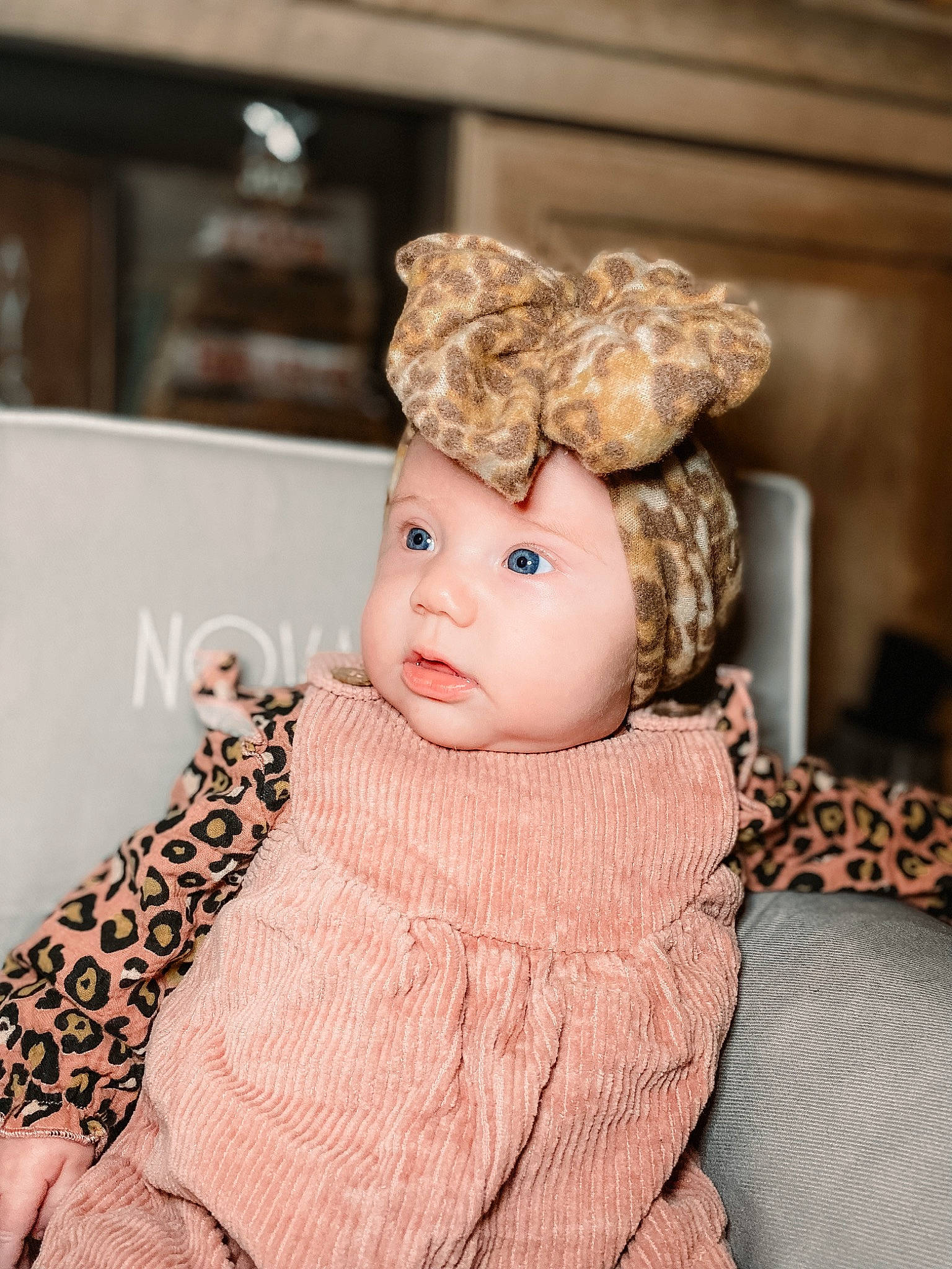 Novah joined the competition — help win amazing prizes! baby, baby_toddler_clothing, blond, brown_hair, cap, cheek, eyelash, fashion_accessory, fashion_design, fur, hair_accessory, hairstyle, happy, head, headgear, headpiece, headwear, person, pink, sitting