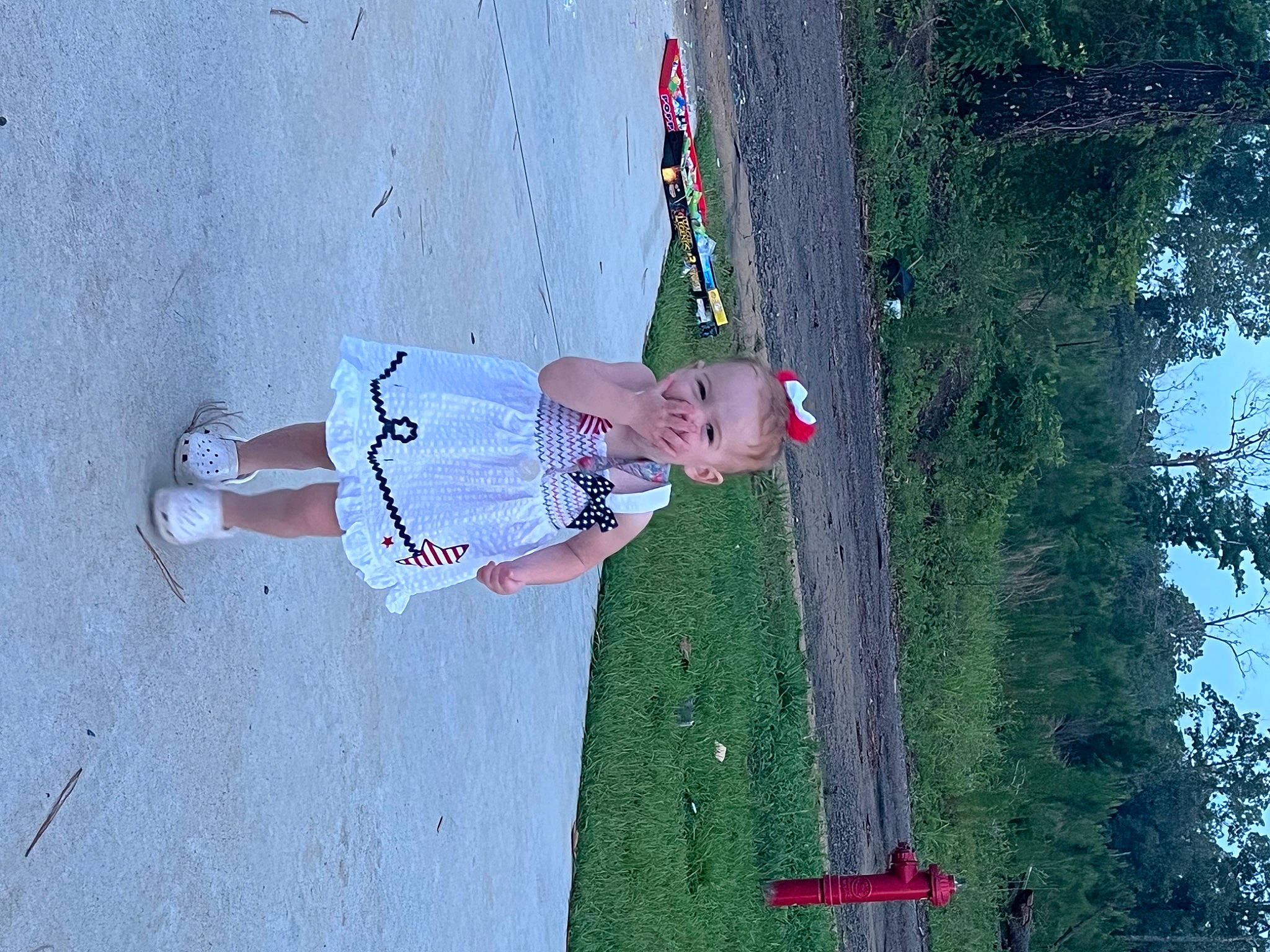 Taylor joined the competition — help win amazing prizes! adventure, asphalt, child, concrete, fun, grass, human_leg, landscape, leisure, person, plant, recreation, shadow, sidewalk, sky, sport_climbing, toddler, tree, walking_shoe, water