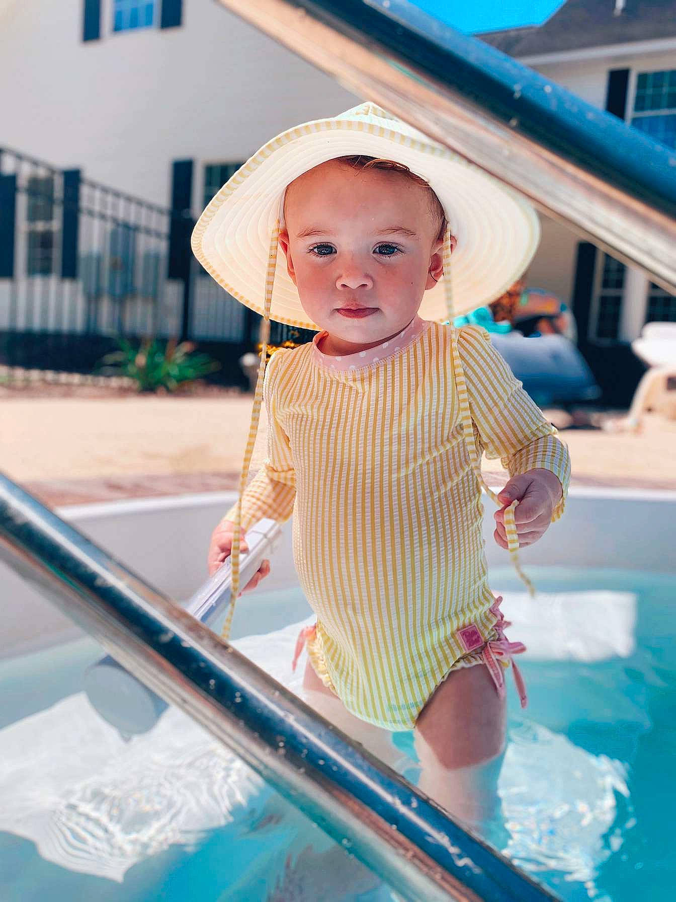 Taylor joined the competition — help win amazing prizes! baby, blue, cap, child, dress, electric_blue, fashion_accessory, fun, happy, hat, leisure, pattern, person, pink, recreation, skin, summer, swimming_pool, swimwear, toddler