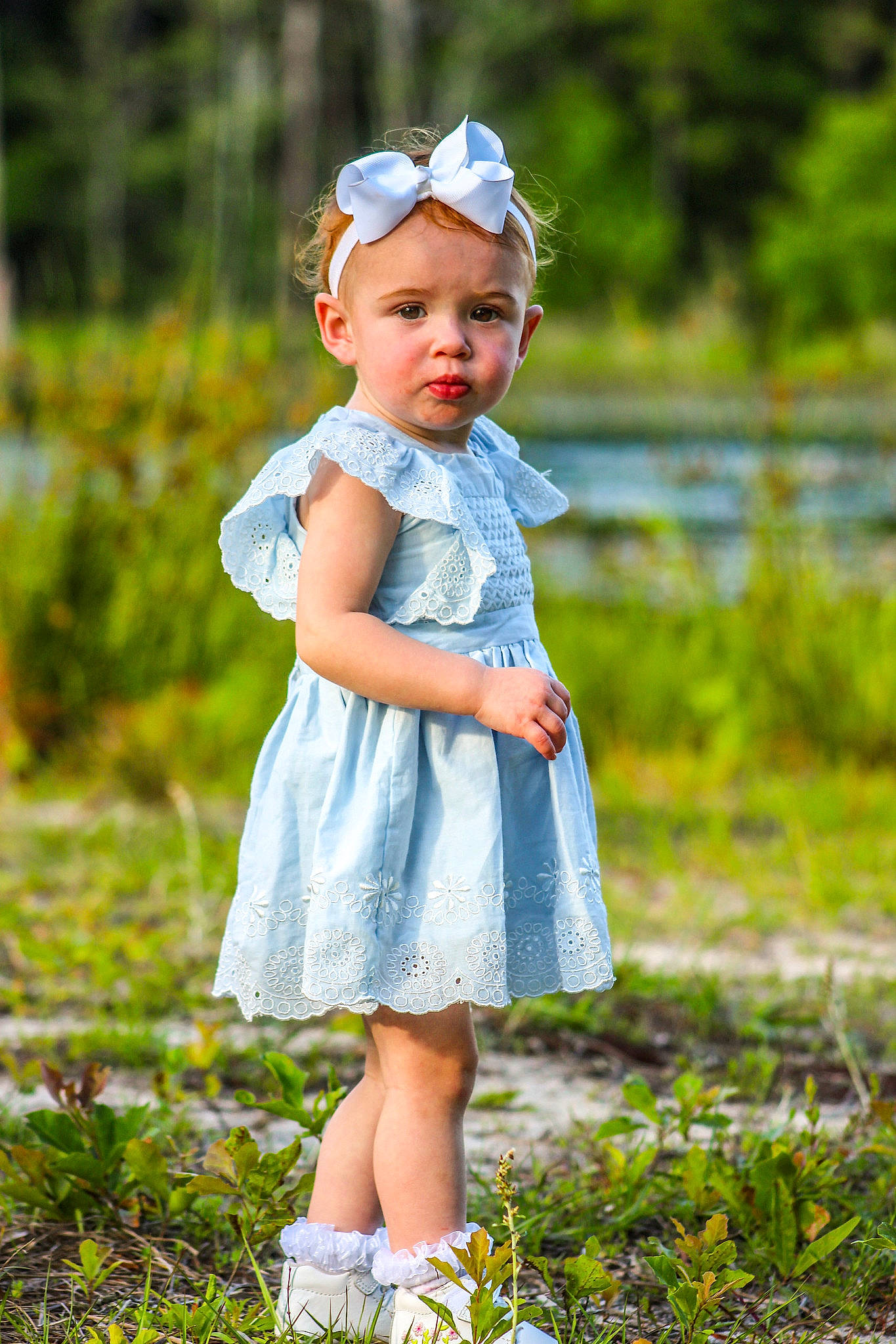 Taylor joined the competition — help win amazing prizes! baby, baby_toddler_clothing, beauty, child, clothing, day_dress, dress, electric_blue, grass, grassland, happy, headwear, one_piece_garment, pattern, people_in_nature, person, photograph, plant, sleeve, spring