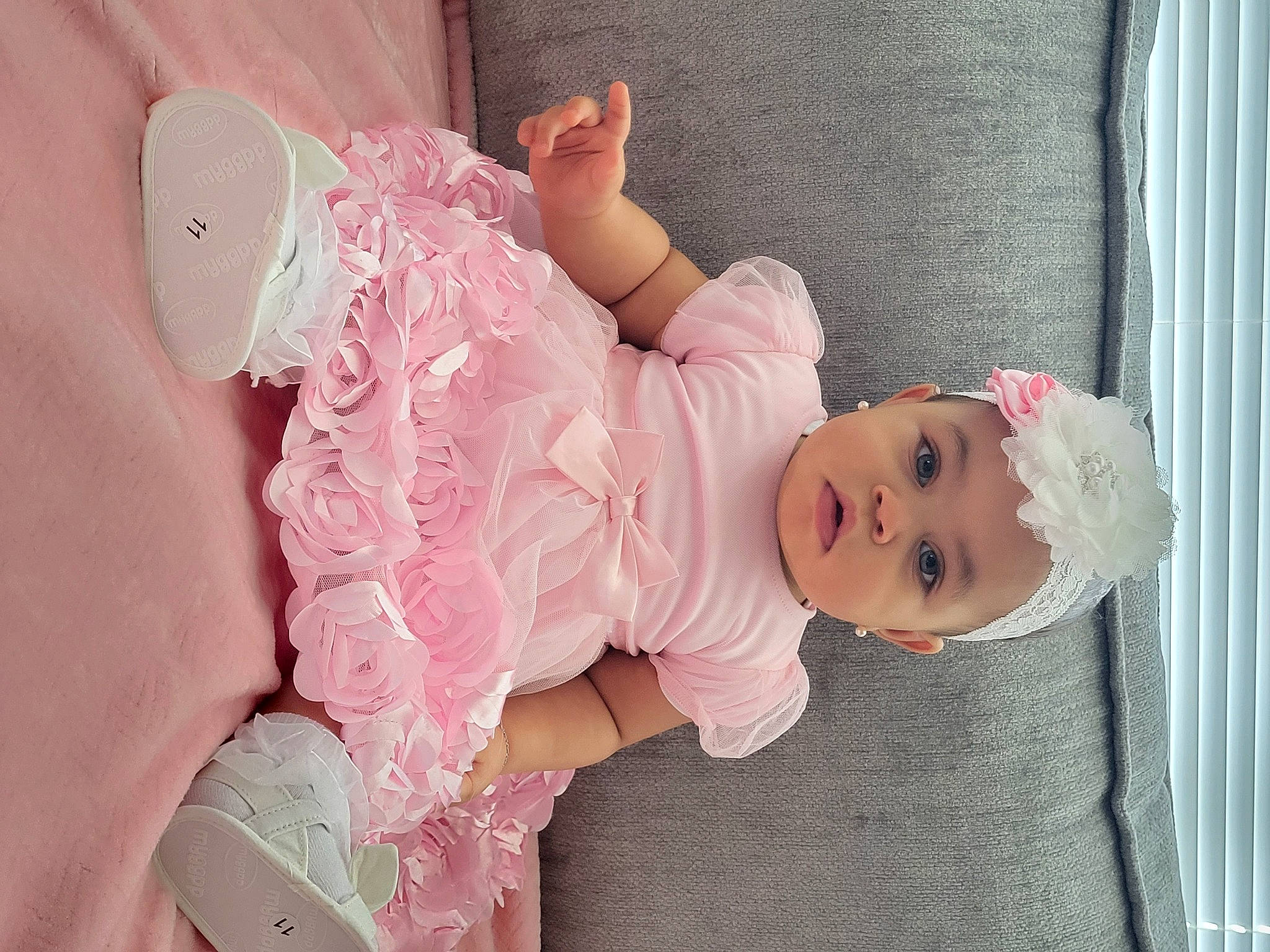 Hudsin is registered to the contest to win money with this photo: arm, baby, baby_products, baby_toddler_clothing, child, comfort, curtain, dress, headgear, headwear, linens, magenta, pattern, person, pink, plant, product, room, skin, sleeve