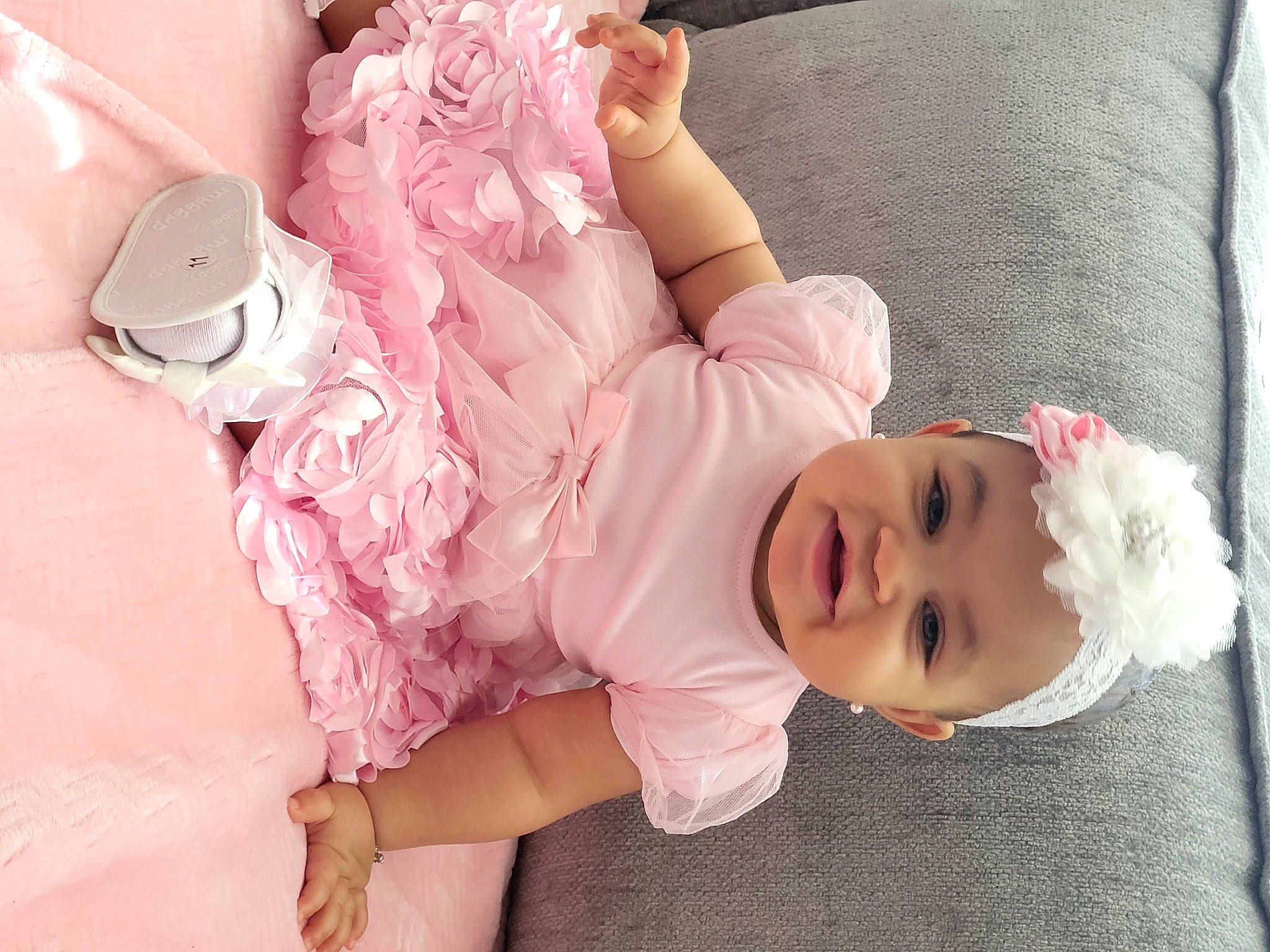 Hudsin joined the competition — help win amazing prizes! baby, baby_toddler_clothing, child, comfort, dress, embellishment, happy, head, headgear, headpiece, headwear, human_body, human_leg, person, pink, skin, sleeve, smile, sock, textile