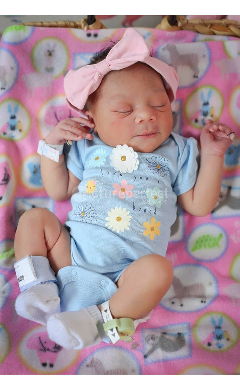 Ilynd is registered to the contest to win money with this photo: baby, baby_products, baby_toddler_clothing, cheek, child, comfort, hand, happy, linens, magenta, pattern, person, pink, play, product, sitting, skin, sleeve, sock, textile