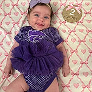 Everley joined the competition — help win amazing prizes! baby, infant, smiling, purple_outfit, tutu, headband, blanket, hearts, milestone, sign, 2_months, cute, happy, lying_down, young_child, portrait, indoor, soft_lighting, adorable, baby_clothes