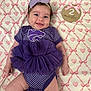 baby, infant, smiling, purple_outfit, tutu, headband, blanket, hearts, milestone, sign, 2_months, cute, happy, lying_down, young_child, portrait, indoor, soft_lighting, adorable, baby_clothes