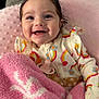 Everley is registered to the contest to win money with this photo: baby, smiling, blanket, pink, rainbow, pacifier, clothing, infant, happy, cute, face, child, cozy, soft, portrait, sitting, indoors, warm, young, person