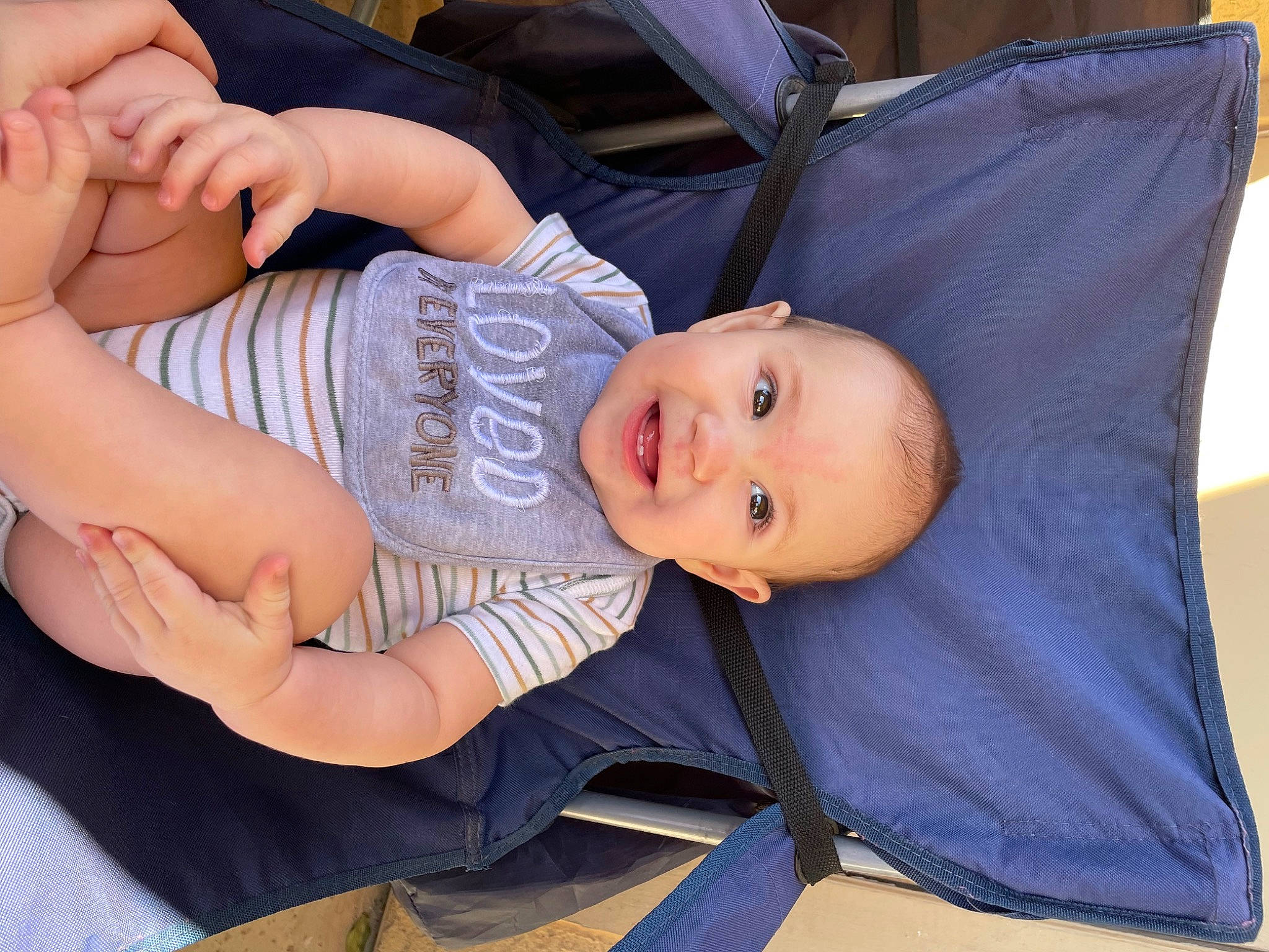 Rafael is registered to the contest to win money with this photo: abdomen, arm, baby, baby_products, baby_toddler_clothing, chest, comfort, elbow, finger, gesture, hand, happy, joy, mouth, person, product, sitting, skin, smile, thigh