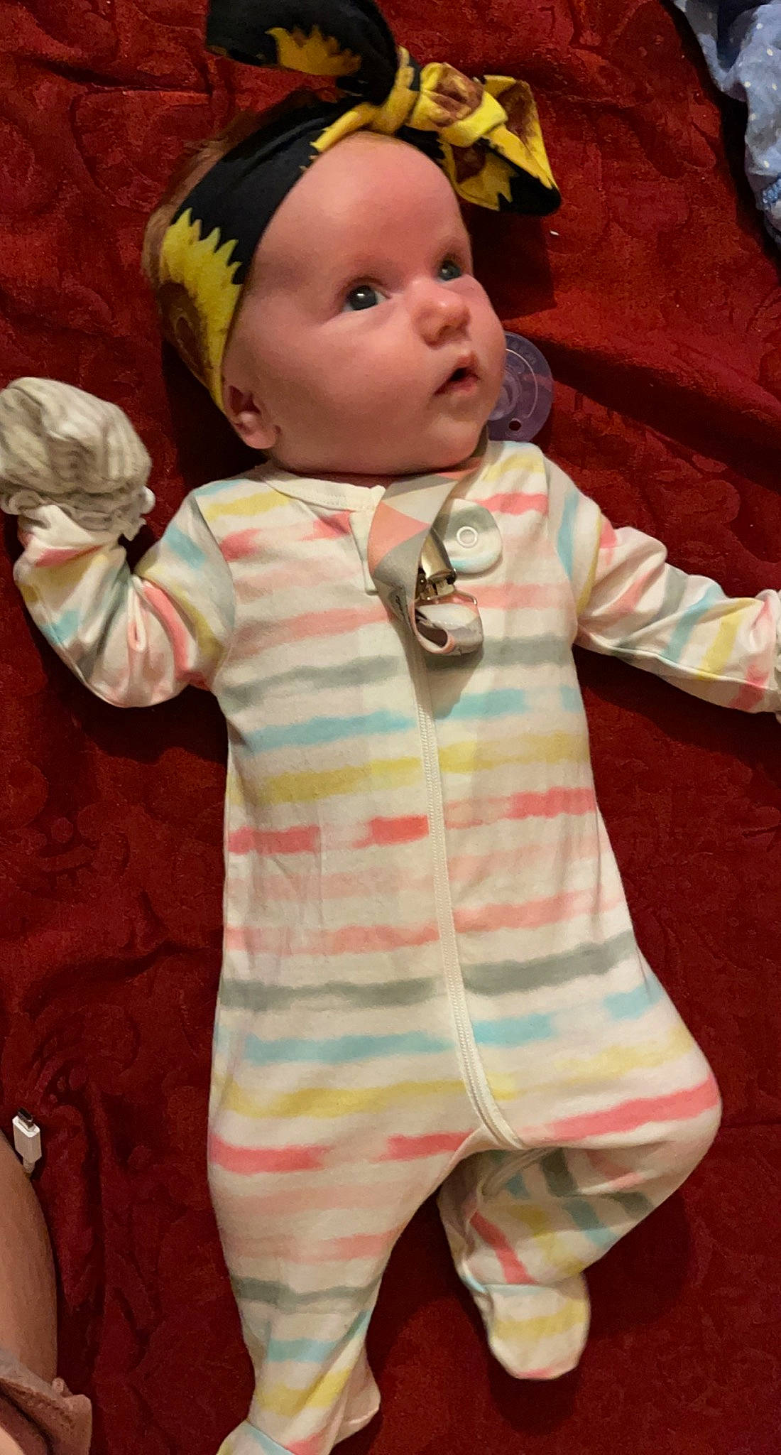 Braelynn is registered to the contest to win money with this photo: arm, baby, baby_toddler_clothing, cap, cheek, chin, face, facial_expression, gesture, green, hairstyle, hand, head, headwear, human_body, mouth, nose, organ, person, pink