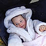 Valentina a rejoint le concours — aidez-le/la à gagner de superbes lots ! baby, infant, stroller, blanket, white_coat, hood, blue_eyes, rosy_cheeks, hand, smile, fluffy, winter_clothing, outdoor, canopy, portrait, closeup, cozy, cute, sitting, soft_texture