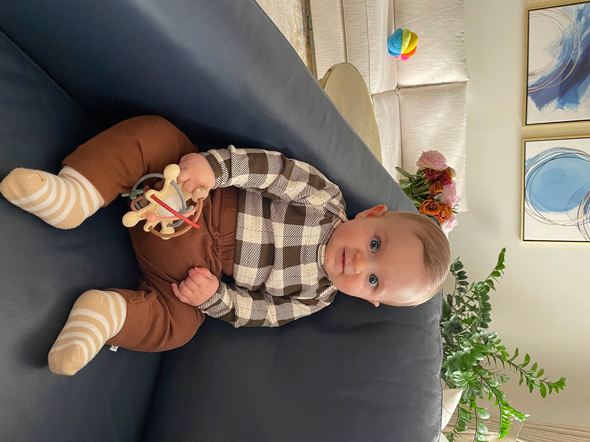 Liam joined the competition — help win amazing prizes! baby, baby_products, baby_toddler_clothing, child, comfort, couch, flowerpot, foot, fun, hat, houseplant, human_leg, knee, leg, plant, room, sitting, sock, thigh, toddler