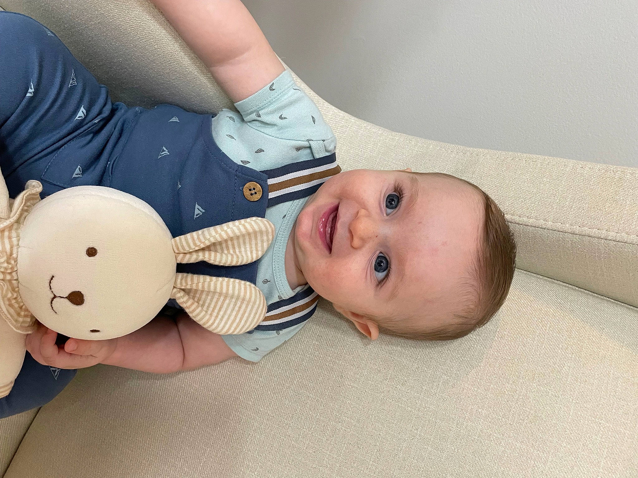 Liam is registered to the contest to win money with this photo: arm, baby_toddler_clothing, cheek, eye, eyelash, facial_expression, finger, gesture, hand, happy, head, headgear, human_body, joy, leg, lip, neck, nose, person, skin