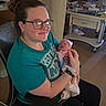 Mazikeen joined the competition — help win amazing prizes! woman, baby, newborn, hospital, chair, glasses, smile, holding, blanket, hat, medical, person, indoor, parent, mother, seated, comfort, care, happy, family