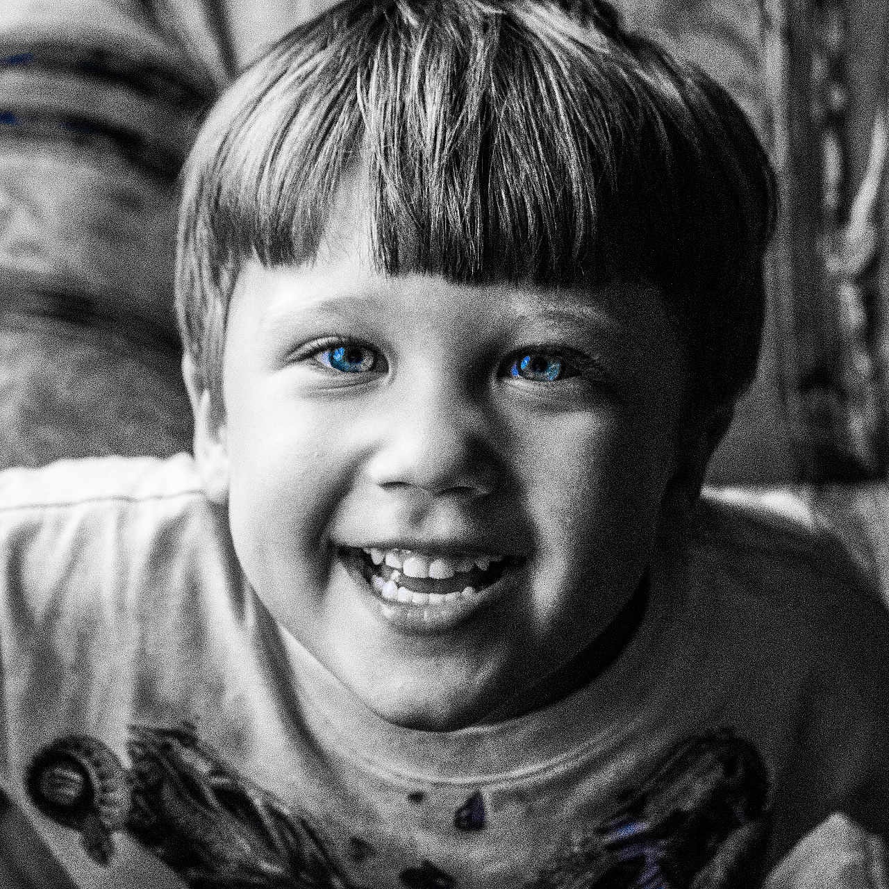 Rodney is registered to the contest to win money with this photo: child, boy, smile, blue_eyes, face, portrait, black_and_white, hair, happy, young, indoors, tshirt, candid, closeup, person, cute, cheerful, childhood, expression, human