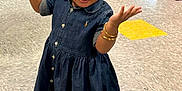 Star is registered to the contest to win money with this photo: toddler, child, denim_dress, indoor, floor_tiles, vending_machine, playful, smiling, sandals, bracelets, curly_hair, person, young_child, colorful_floor, bright_lighting, open_arms, cute, casual_clothing, happy, retail_space