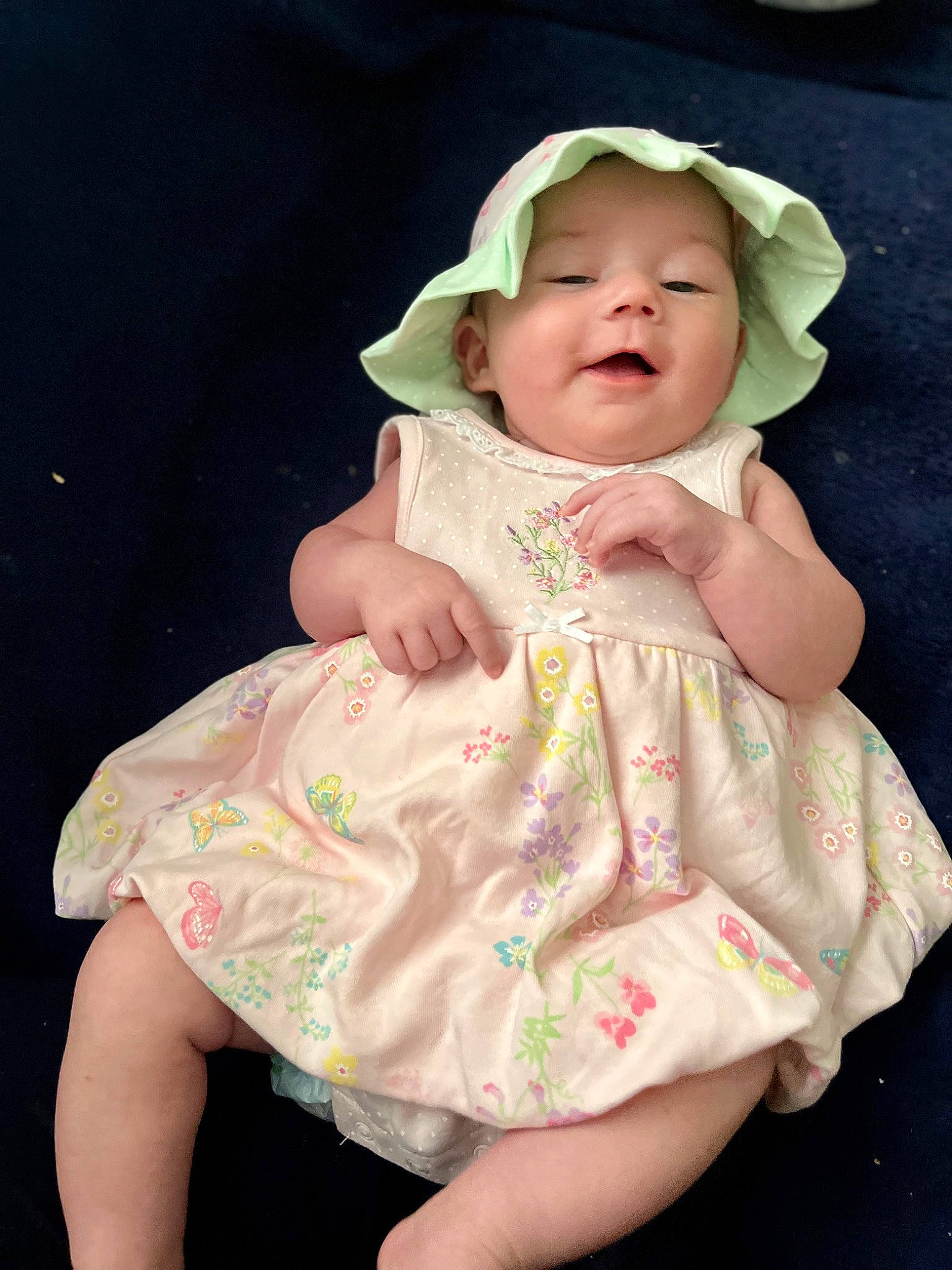 Saphina is registered to the contest to win money with this photo: baby, baby_toddler_clothing, beauty, cap, cheek, child, collar, dress, face, happy, hat, head, headgear, human_body, lip, pattern, person, pink, skin, sleeve