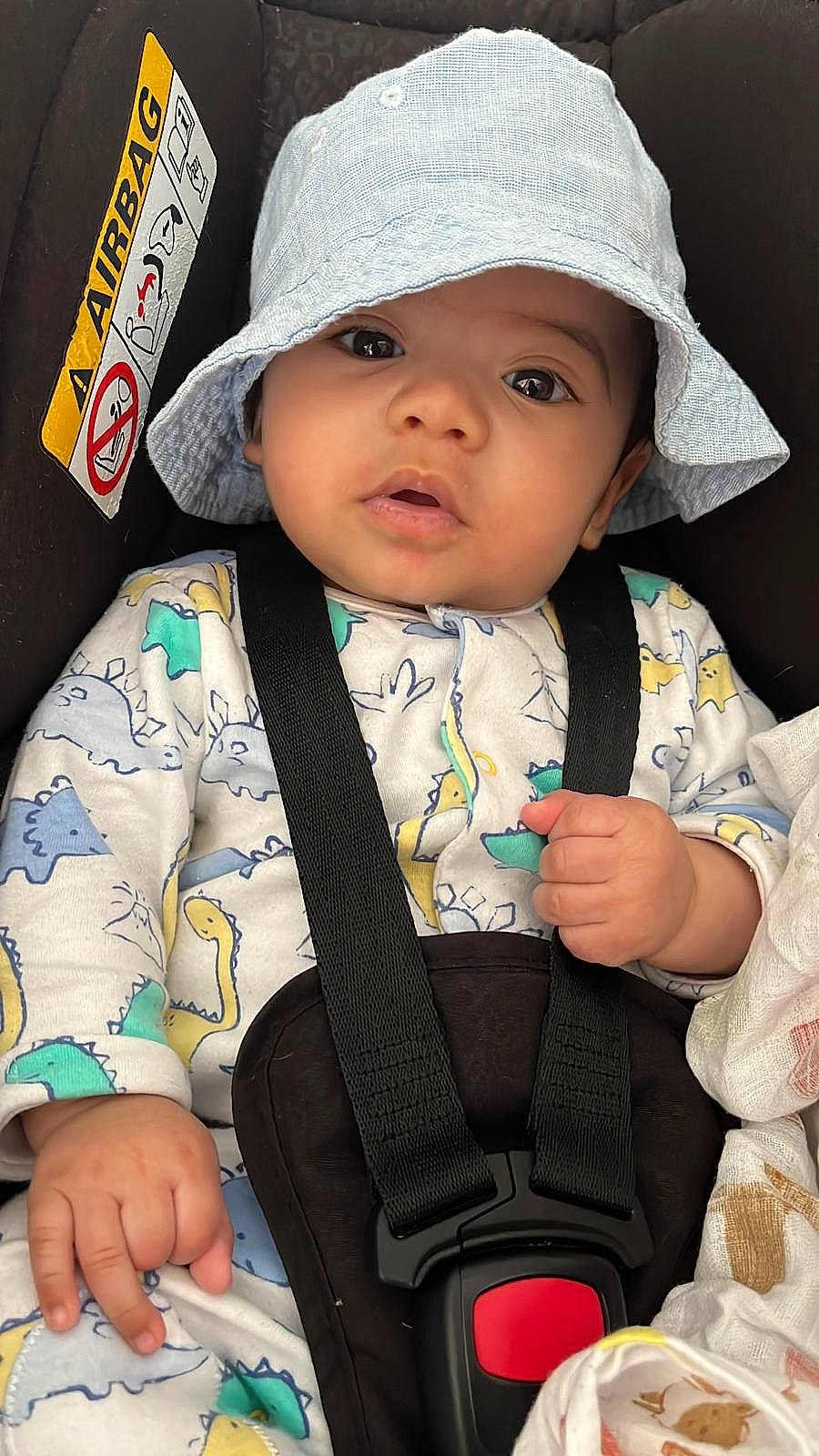 Michael participe au concours pour gagner de l'argent avec cette photo : baby, baby_carriage, baby_in_car_seat, baby_products, baby_toddler_clothing, cap, car_seat, cheek, child, cool, eye, fashion_accessory, finger, hand, headwear, outerwear, pattern, person, sitting, skin