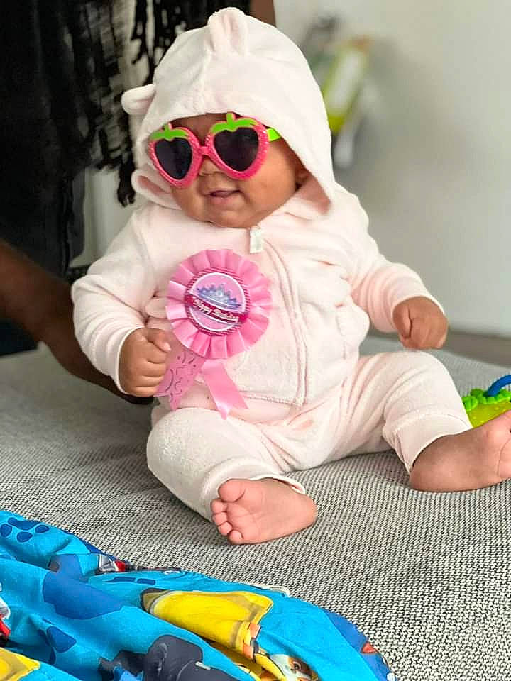 Jakayla joined the competition — help win amazing prizes! baby, baby_toddler_clothing, blue, cap, child, eyewear, fun, goggles, happy, headwear, mouth, person, photograph, skin, sleeve, sunglasses, textile, toddler, toy, vision_care