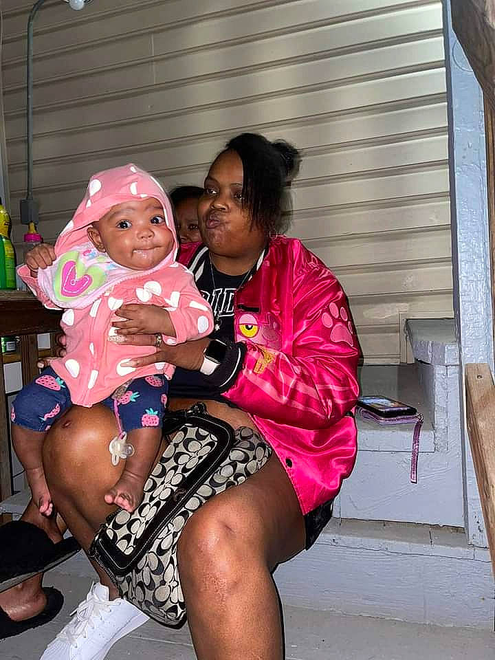 Jakayla joined the competition — help win amazing prizes! abdomen, baseball_cap, cap, chest, event, eyewear, fun, happy, hat, headwear, human_leg, jewellery, leisure, magenta, necklace, person, pink, sitting, sun_hat, thigh