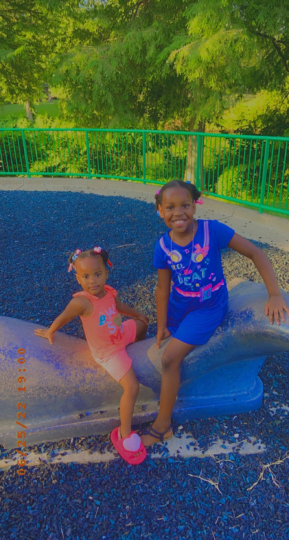 Keymora And Kamara is registered to the contest to win money with this photo: child, electric_blue, fun, grass, green, happy, joy, leg, leisure, people_in_nature, person, pink, plant, recreation, shorts, smile, t_shirt, thigh, toddler, tree