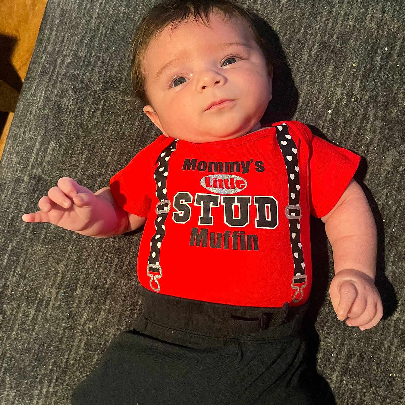 Jake joined the competition — help win amazing prizes! baby, black_pants, child, clothing, cute, expression, eyes, face, floor, hair, hands, indoor, infant, lying_down, person, portrait, red_shirt, skin, text_on_clothing, young