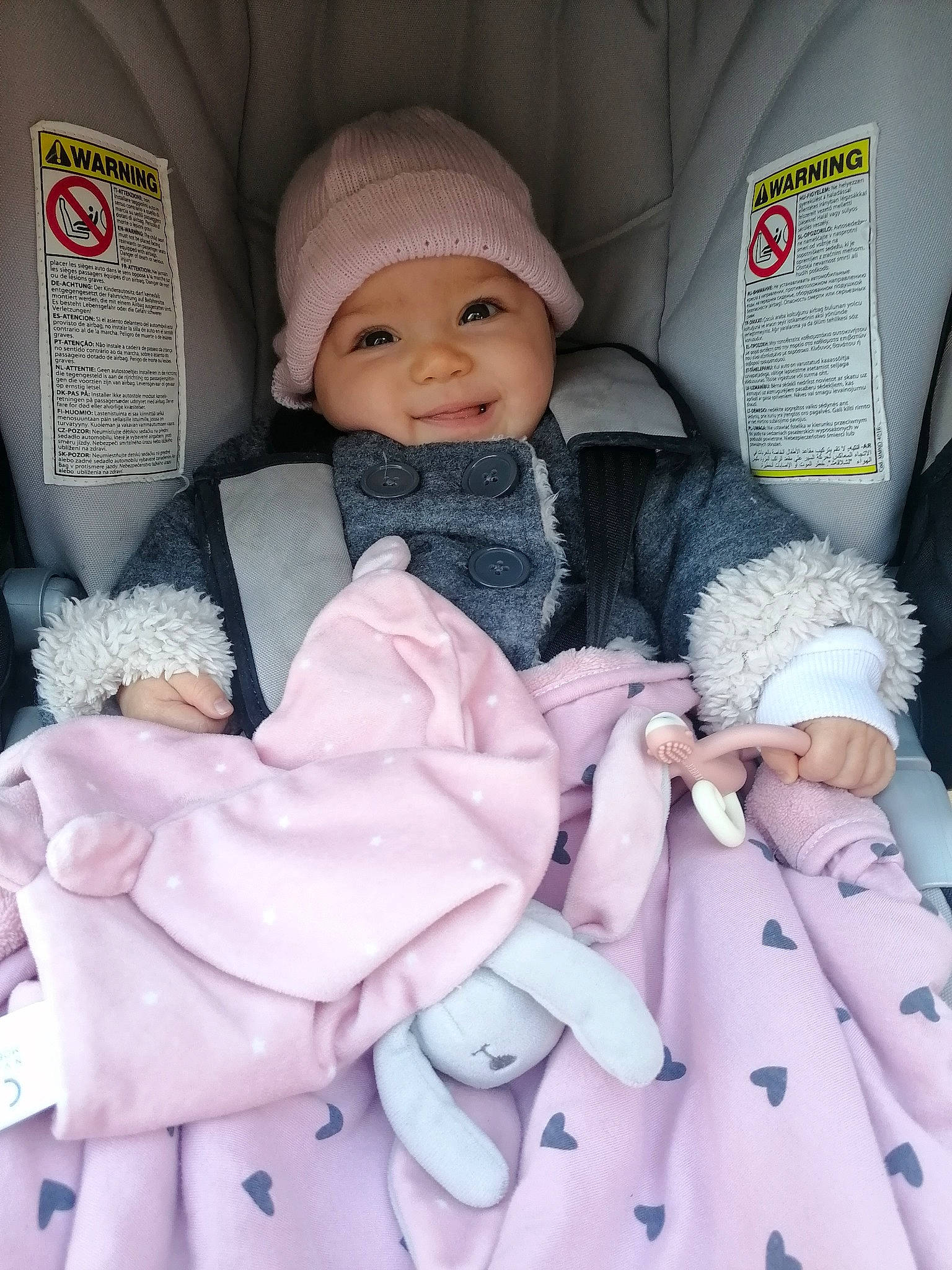 Juliette participe au concours pour gagner de l'argent avec cette photo : baby, baby_toddler_clothing, cap, cheek, child, doll, eyelash, fashion_accessory, fashion_design, headwear, knit_cap, outerwear, pattern, person, pink, skin, sleeve, smile, textile, toy