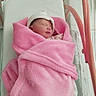 Thaïly participe au concours pour gagner de l'argent avec cette photo : newborn, baby, blanket, pink, hat, sleeping, hospital, bassinet, bed, infant, wrapped, cute, child, cozy, soft, resting, healthcare, person, newborn_baby, nursery