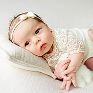 Rimantė joined the competition — help win amazing prizes! baby, infant, newborn, face, headband, pillow, lace, clothing, skin, hand, fingers, sleeping, lying_down, cute, soft, portrait, closeup, indoors, child, peaceful