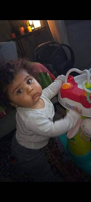 Aniya is registered to the contest to win money with this photo: baby, baby_products, baby_toddler_clothing, chair, cheek, child, drinkware, ear, event, face, finger, fun, happy, iris, nose, person, room, stuffed_toy, t_shirt, toddler