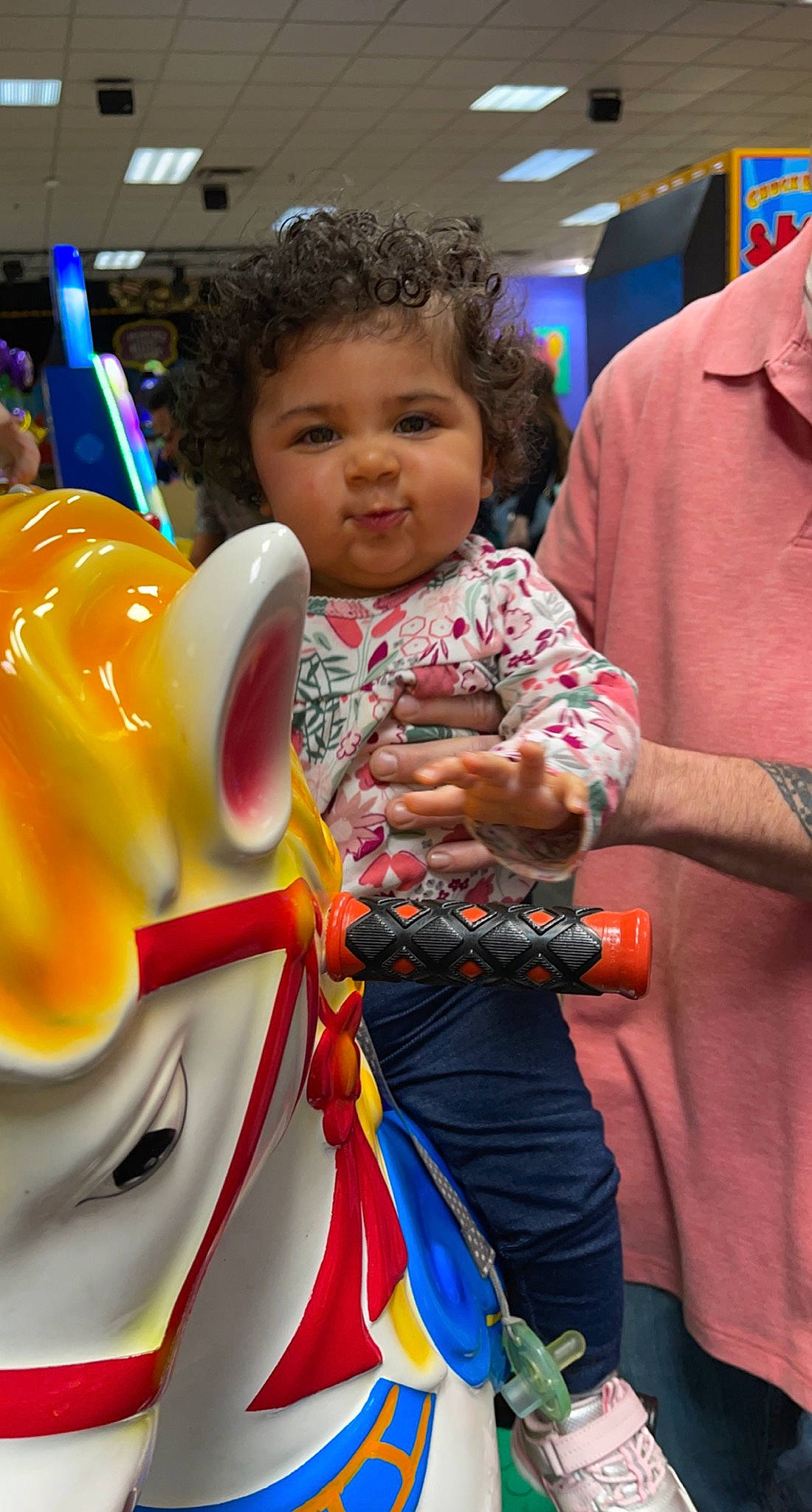 Aniya is registered to the contest to win money with this photo: baby, carousel, child, costume, event, fashion, festival, fun, hairstyle, happy, leisure, nonbuilding_structure, person, product, public_event, recreation, skin, standing, t_shirt, toddler