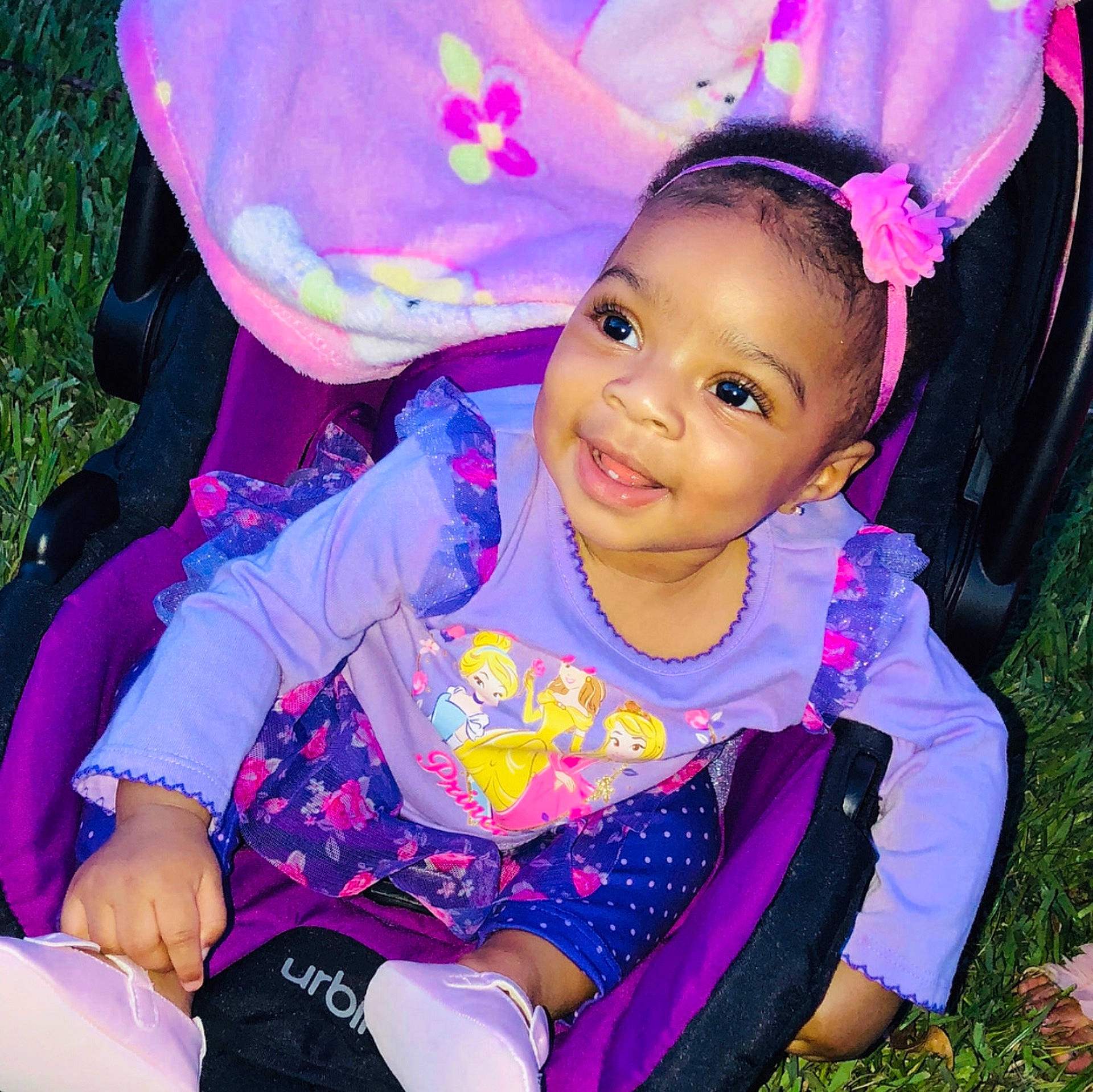 Chasity is registered to the contest to win money with this photo: child, cool, day, eye, face, fun, girl, happiness, head, headgear, infant, person, pink, play, product, purple, sitting, skin, smile, textile