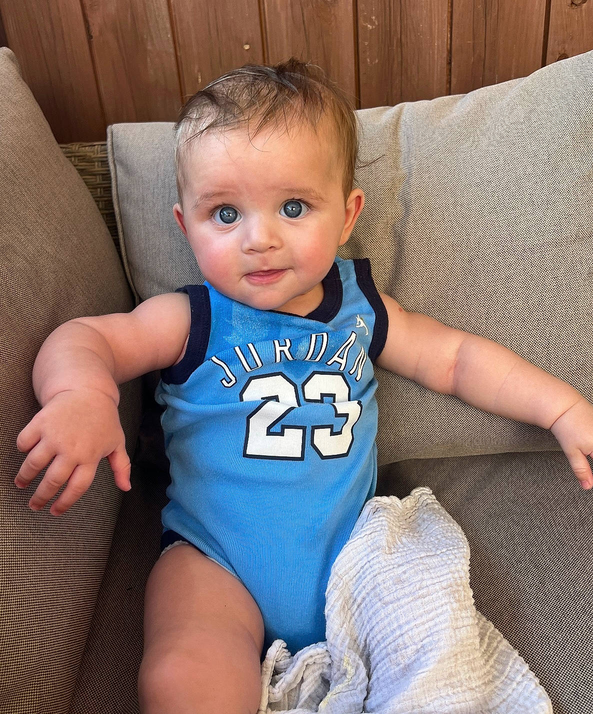 Jacob is registered to the contest to win money with this photo: arm, azure, baby, baby_toddler_clothing, cheek, eye, finger, happy, head, infant_bodysuit, iris, joint, knee, person, skin, sleeve, smile, sportswear, thigh, toddler