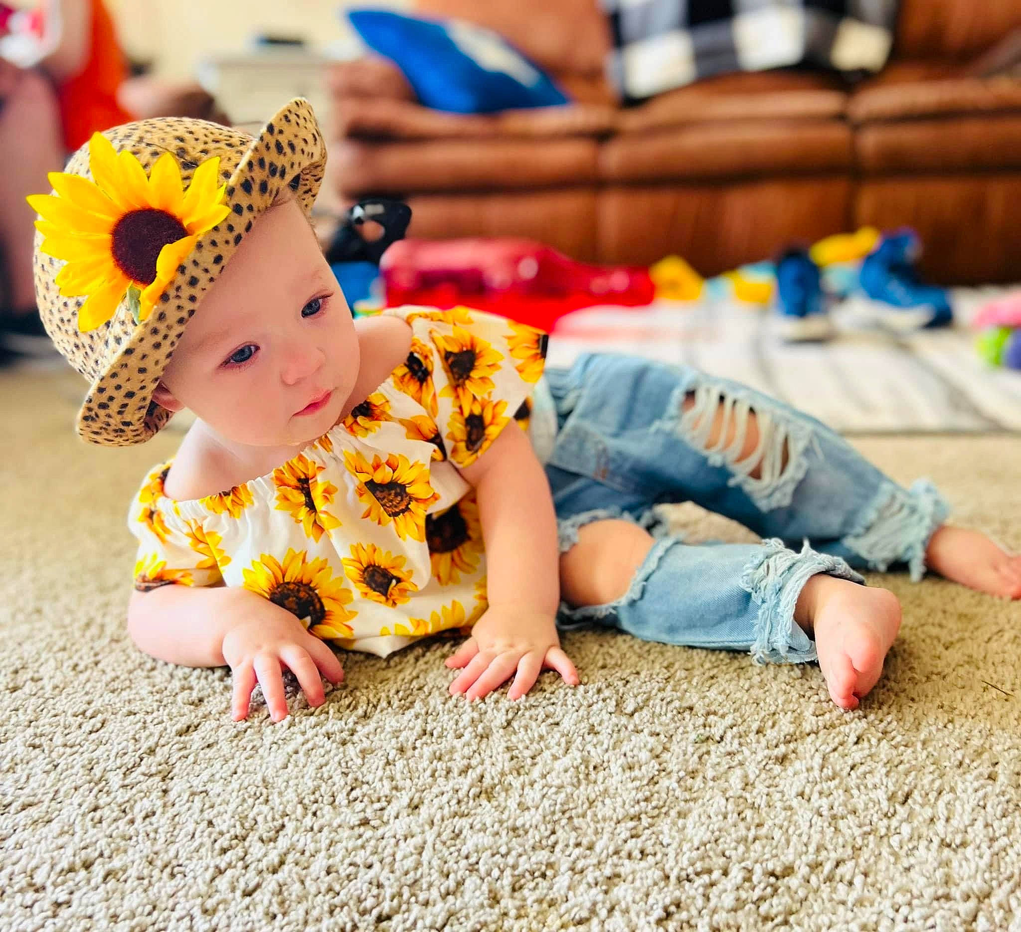 Brayleigh is registered to the contest to win money with this photo: baby, baby_toddler_clothing, barefoot, child, floor, flooring, foot, fun, happy, hat, headwear, human_leg, leg, leisure, pattern, person, sitting, skin, sleeve, toddler