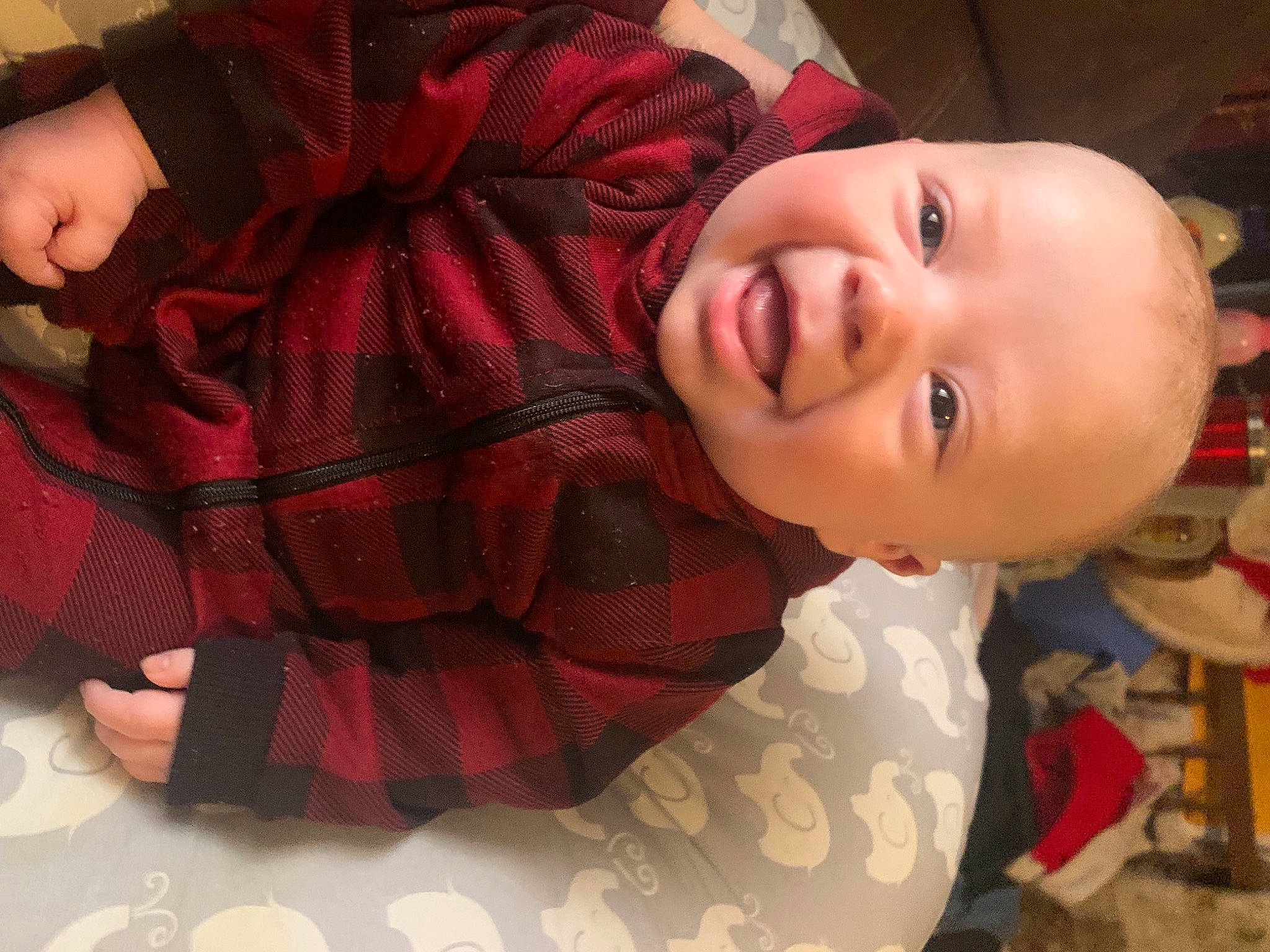 Rate-jen is registered to the contest to win money with this photo: baby, baby_laughing, baby_toddler_clothing, cheek, child, comfort, fun, happy, human_body, mouth, nose, pattern, person, plaid, skin, sleeve, smile, tartan, toddler, window