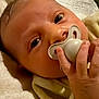 Cassidy participe au concours pour gagner de l'argent avec cette photo : baby, pacifier, blanket, hand, face, infant, newborn, skin, eyes, clothing, soft, cute, child, person, portrait, baby_clothes, lying_down, close_up, fingers, resting