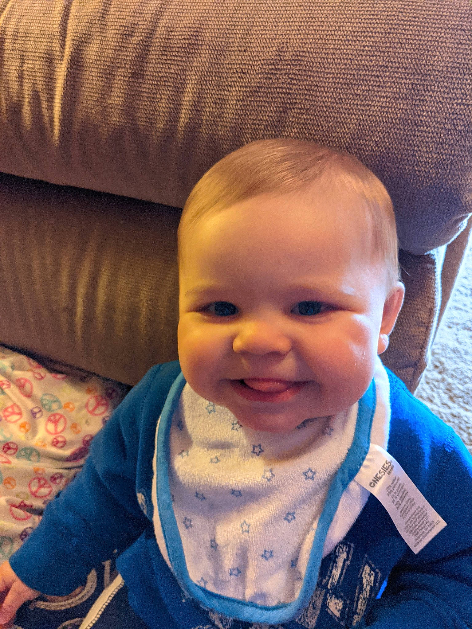 Tucker is registered to the contest to win money with this photo: baby, baby_toddler_clothing, blue, cheek, chin, ear, eye, eyebrow, forehead, hairstyle, happy, human, iris, joy, lip, mouth, neck, nose, person, skin