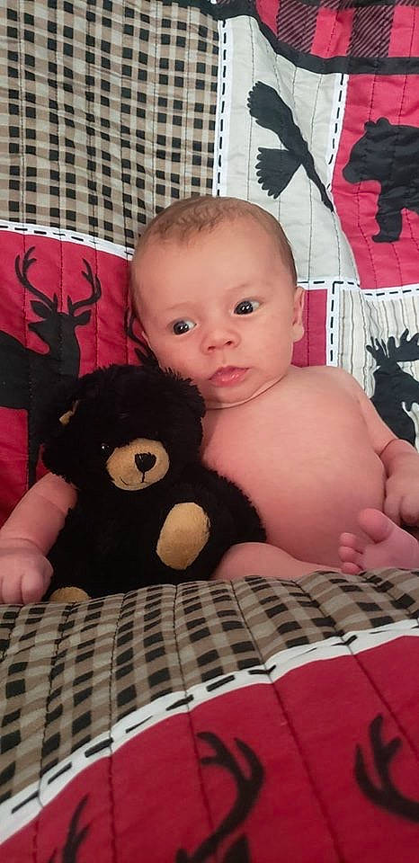 Kenton joined the competition — help win amazing prizes! baby, black_hair, cheek, child, eye, face, furniture, head, iris, leg, linens, lip, nose, person, pink, skin, stuffed_toy, textile, thigh, toddler