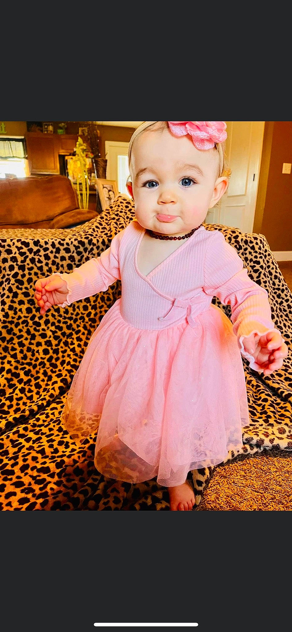 Ophelia is registered to the contest to win money with this photo: baby, baby_toddler_clothing, cheek, child, day_dress, dress, flash_photography, flooring, happy, magenta, one_piece_garment, pattern, peach, person, pink, purple, ruffle, sitting, skin, sleeve