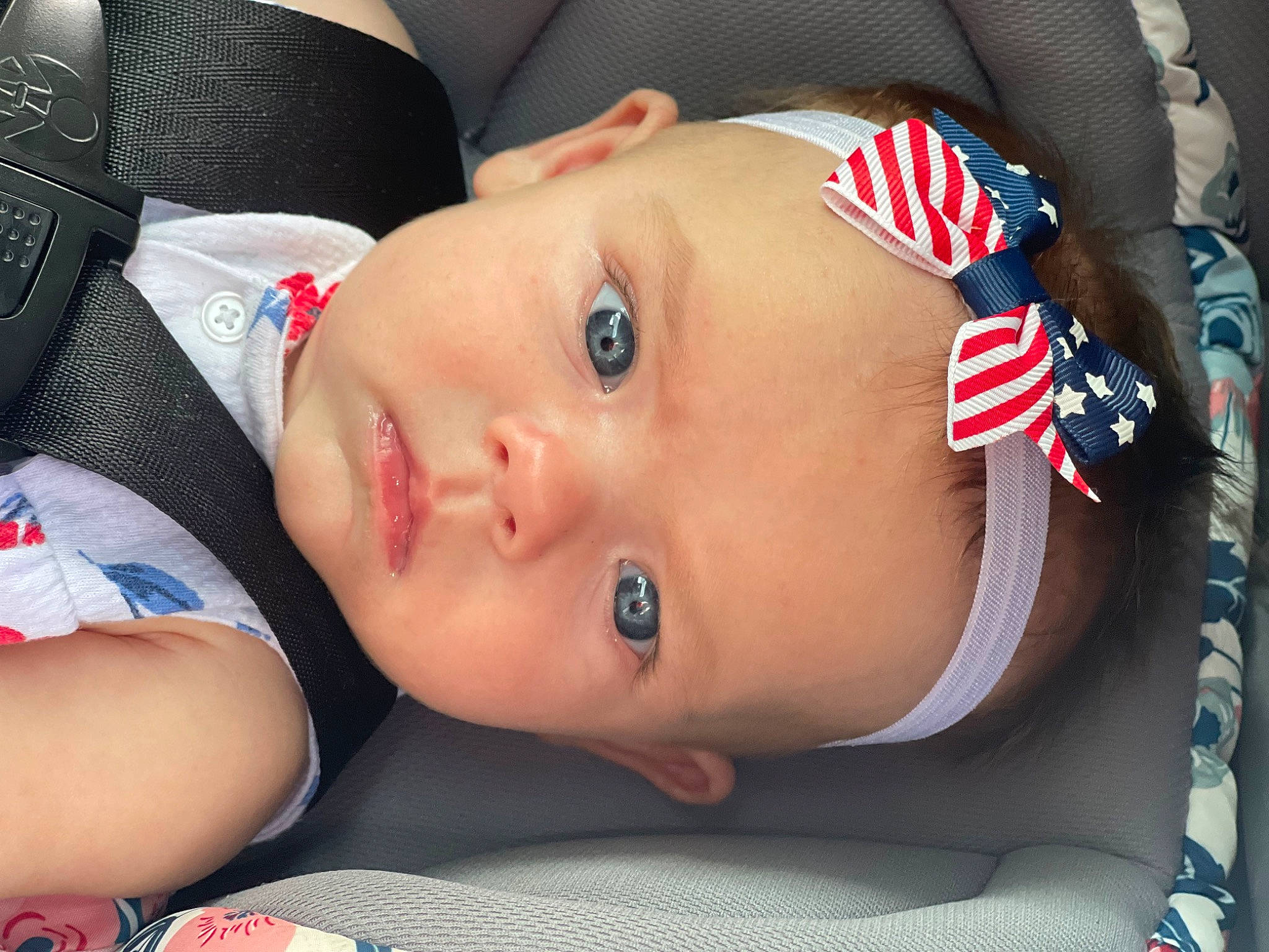 Kinsleigh is registered to the contest to win money with this photo: baby, baby_toddler_clothing, cheek, child, chin, comfort, cool, eye, eyelash, finger, flag, flag_of_the_united_states, hat, headgear, lip, mouth, nose, person, skin, toddler