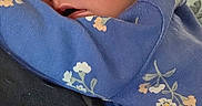 Alayna joined the competition — help win amazing prizes! baby, blue_clothing, closeup, comfort, cute, eyes_open, face, family, floral_pattern, head, heart_graphic, indoors, infant, love_text, newborn, person, skin, sleepy, snuggling, tenderness