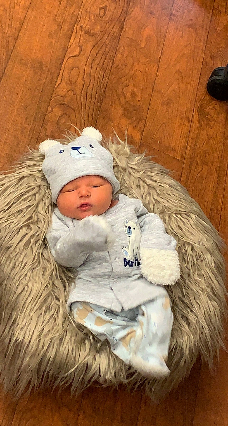Jamie joined the competition — help win amazing prizes! baby, baby_sleeping, baby_toddler_clothing, beanie, cap, cheek, child, comfort, fun, fur, fur_clothing, grass, happy, headgear, headwear, knit_cap, person, sitting, toddler, winter