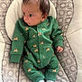 Emmitt joined the competition — help win amazing prizes! awake, baby, bouncer_seat, cozy, cute, dark_hair, fabric_pattern, gaze_left, green_onesie, home_interior, infant, lying_down, newborn, onesie, portrait, reindeer_pattern, small_hands, socks, soft_cushion, tiny_feet