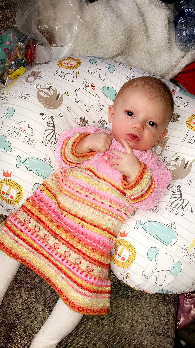 Daniela is registered to the contest to win money with this photo: baby, cheek, child, linens, person, pink, skin, textile, toddler