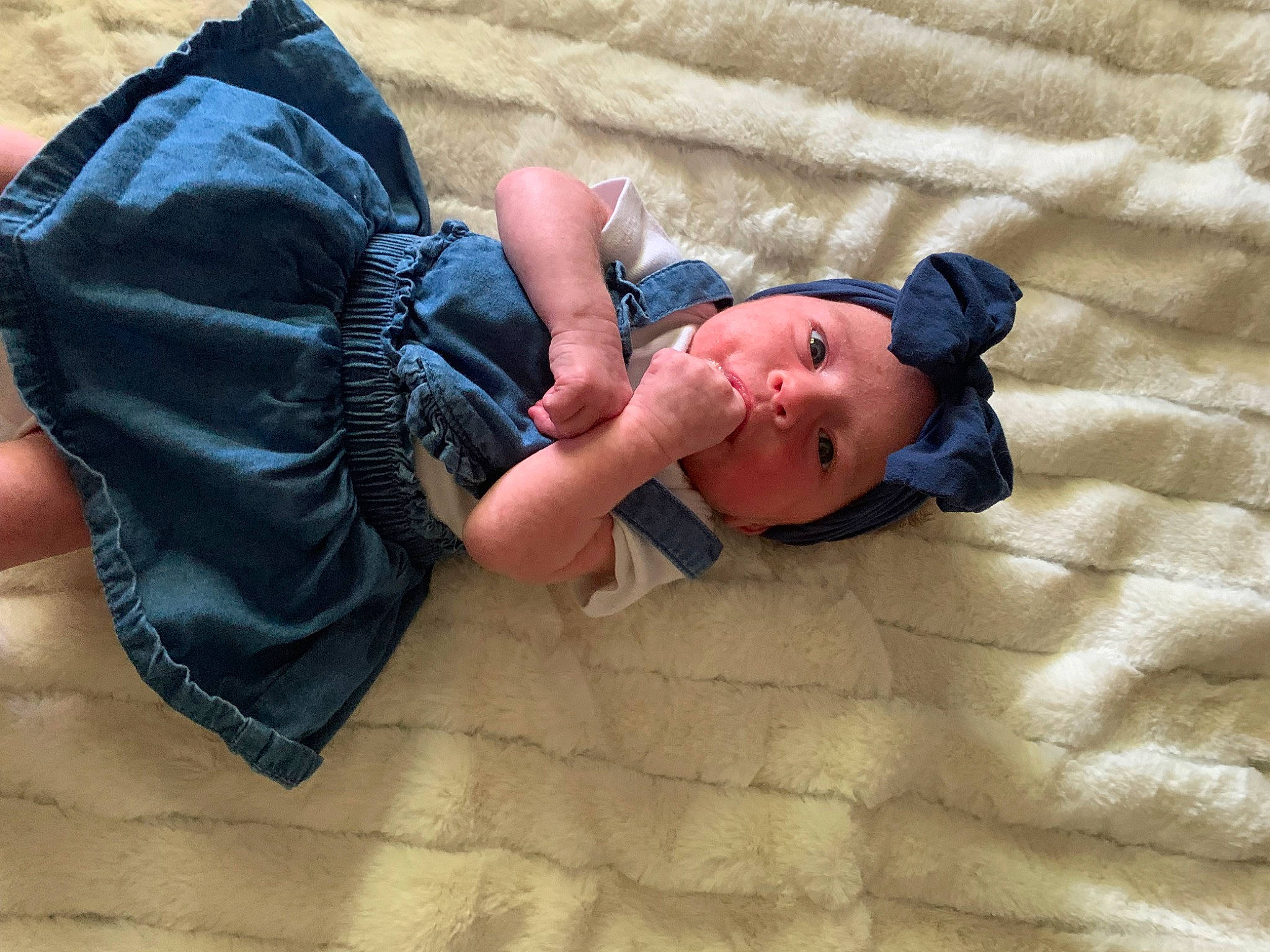 Novalynn is registered to the contest to win money with this photo: baby, baby_toddler_clothing, comfort, elbow, electric_blue, finger, fun, grass, hat, headgear, headwear, human_leg, leisure, linens, pattern, person, sitting, thigh, toddler, tree