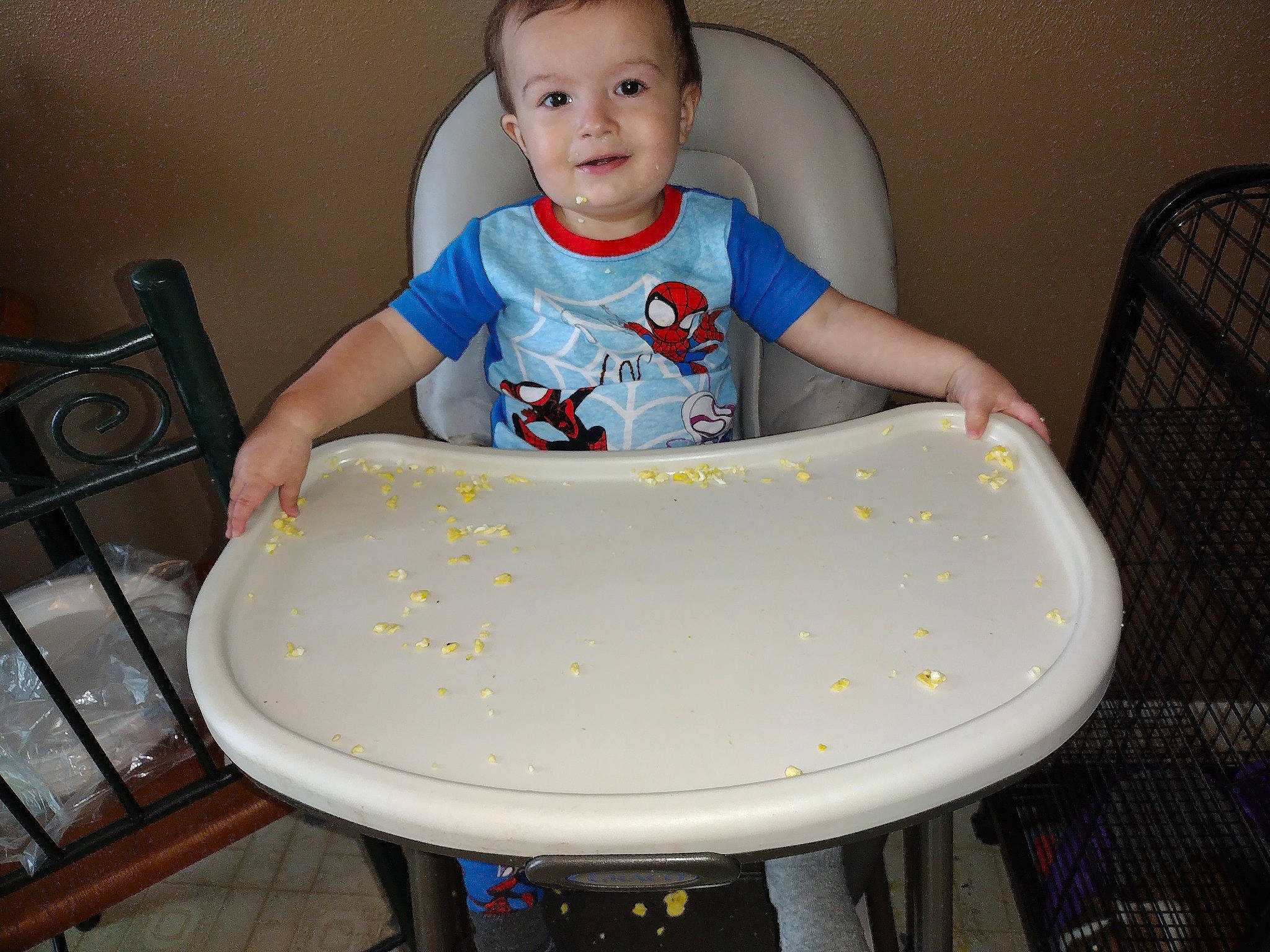 Kaiden joined the competition — help win amazing prizes! baby_toddler_clothing, chair, child, circle, cleanliness, comfort, composite_material, flooring, furniture, hardwood, joy, person, plastic, sitting, sleeve, smile, t_shirt, table, toddler, white