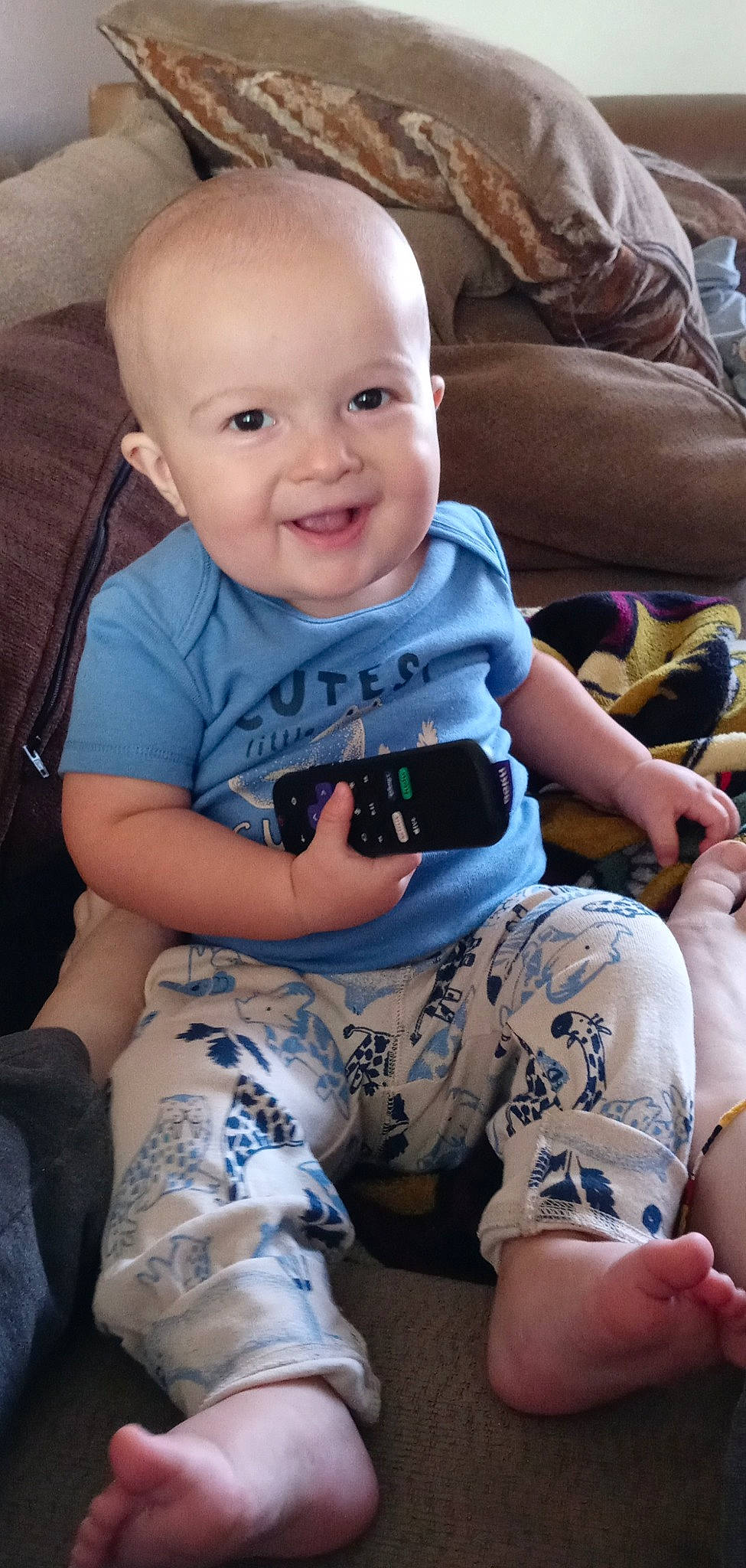 Kaiden is registered to the contest to win money with this photo: baby, baby_toddler_clothing, child, comfort, cool, facial_expression, finger, fun, hairstyle, happy, human_leg, iris, joint, joy, lap, person, skin, sleeve, smile, t_shirt