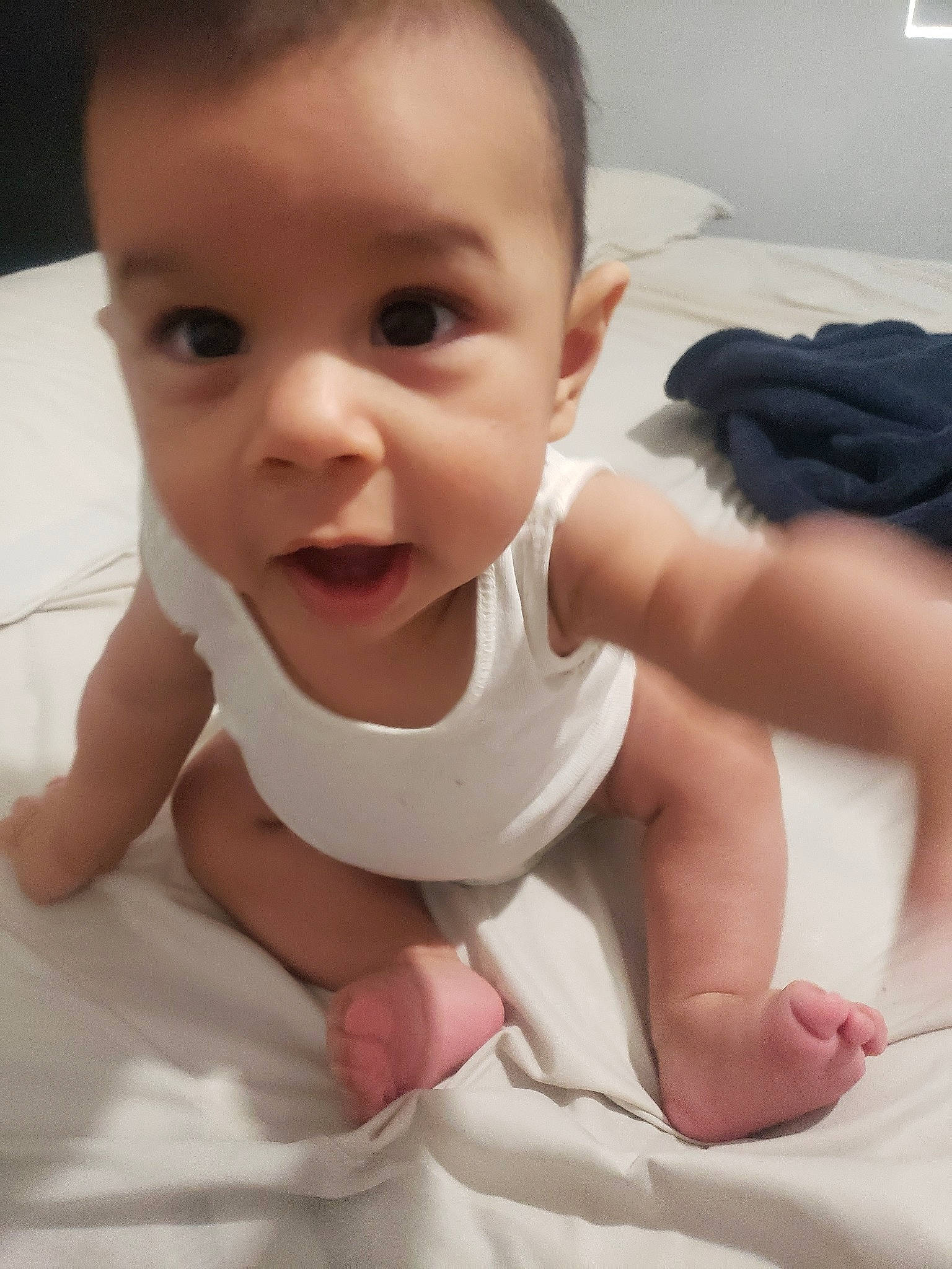 Gohan is registered to the contest to win money with this photo: arm, baby, beauty, cheek, child, chin, eye, face, facial_expression, finger, forehead, hand, head, leg, lip, mouth, nose, person, skin, smile