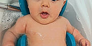 Idriss participe au concours pour gagner de l'argent avec cette photo : baby, bathtub, bath, water, foam, skin, child, blue, support, surprised, expression, infant, naked, bathroom, cute, sitting, wet, person, head, arm