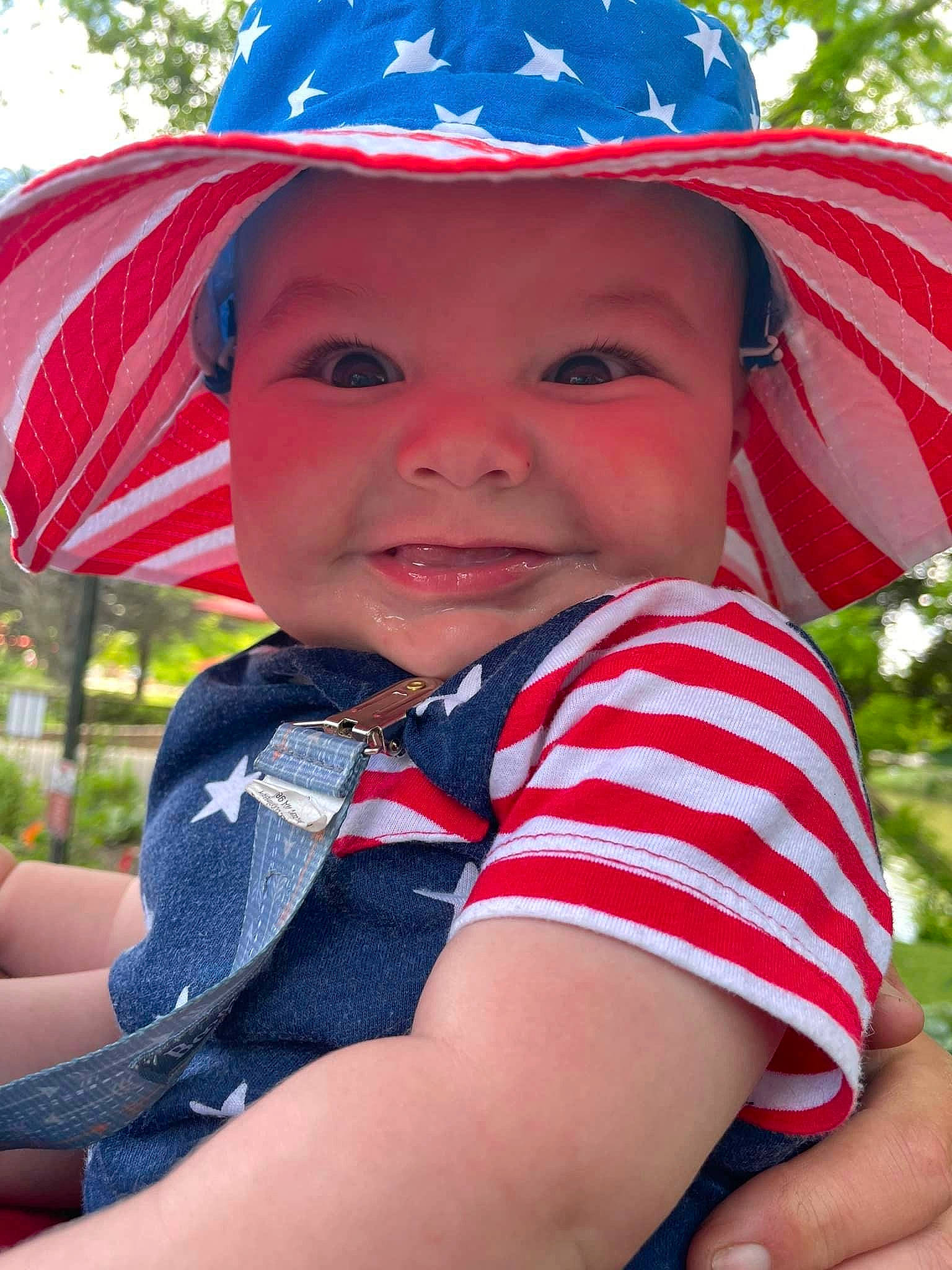 Trace joined the competition — help win amazing prizes! baby_toddler_clothing, blue, cap, child, costume_hat, electric_blue, facial_expression, fun, grass, happy, hat, headgear, headwear, joy, leisure, people_in_nature, person, pink, recreation, red